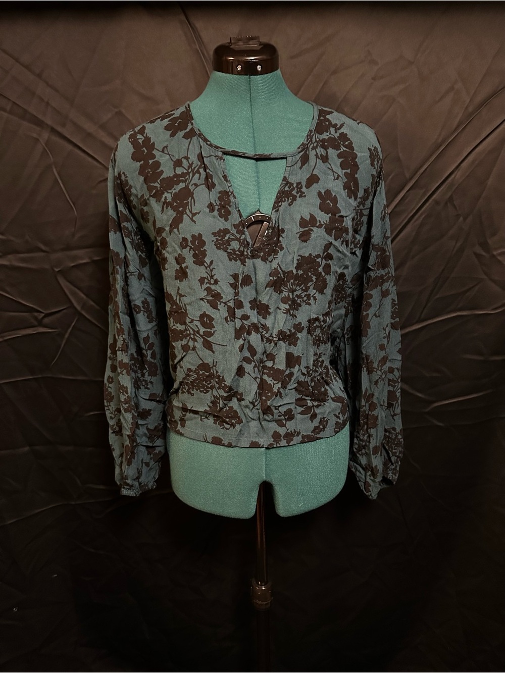 Green and black floral top